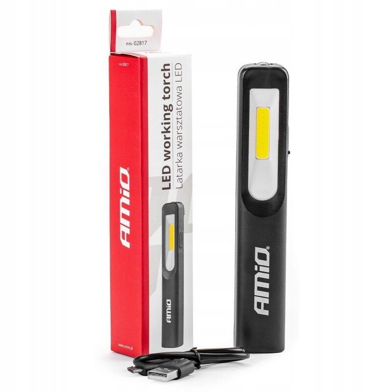 Na obrazie znajduje się czarna lampa warsztatowa LED z żółtym panelem świetlnym oraz opakowanie z napisem \'AMiO LED working torch Latarka warsztatowa LED\'. Obok lampy leży kabel USB.