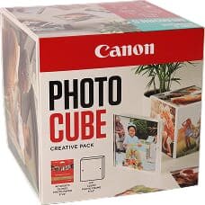 Opakowanie produktu z napisem \'Canon PHOTO CUBE CREATIVE PACK\'. Widoczne są zdjęcia przykładowych zastosowań produktu oraz logo Canon.