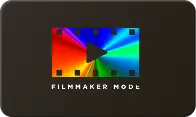 Kolorowy symbol z trójkątem na środku, otoczony czarnymi kwadratami, z napisem \'FILMMAKER MODE\' poniżej.
