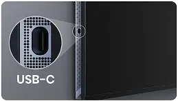 Obraz przedstawia zbliżenie na port USB-C na urządzeniu elektronicznym. Obok portu widoczny jest napis \'USB-C\'.
