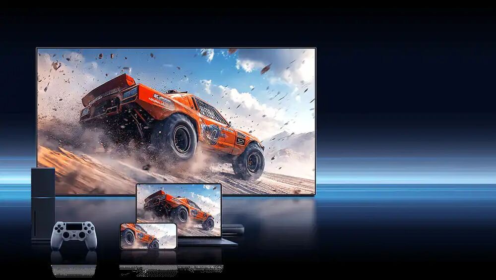 Telewizor HISENSE 65UR8S od frontu, konsola, kontroler, smartfon oraz laptop na ciemnym tle