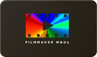 Obrazek przedstawia kolorowy prostokąt z czarnym trójkątem w środku, przypominający przycisk odtwarzania, z napisem \'FILMMAKER MODE\' poniżej.