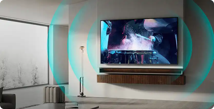 Telewizor na ścianie w salonie wyświetlający koncert z graficznym efektem wychodzących z telewizora fal dźwiękowych