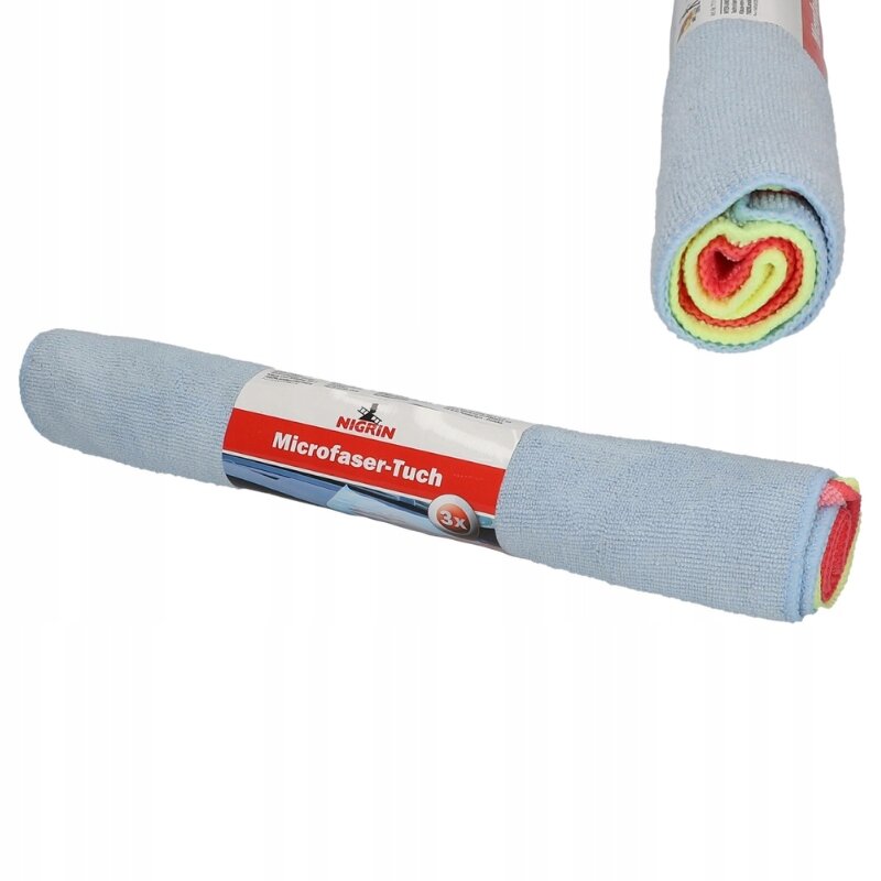 Na obrazie widoczny jest rulon ściereczek z mikrofibry w kolorze niebieskim, z etykietą z napisem \'Nigrin Microfaser-Tuch\'. Wewnątrz rulonu widoczne są ściereczki w kolorach żółtym, czerwonym i zielonym.