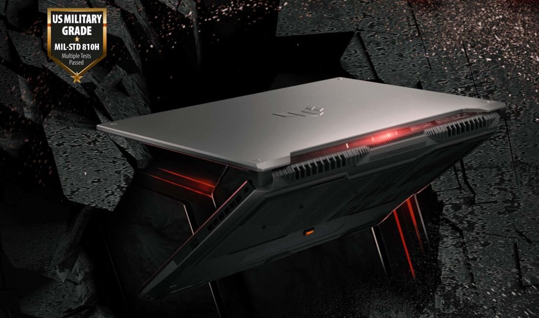 Laptop ASUS TUF Gaming z certyfikatem MIL‑STD‑810H unosi się nad skalnym tłem, symbolizując wytrzymałość w grach – testy wibracji uderzeń temperatury i pracy na dużych wysokościach potwierdzające odporność obudowy