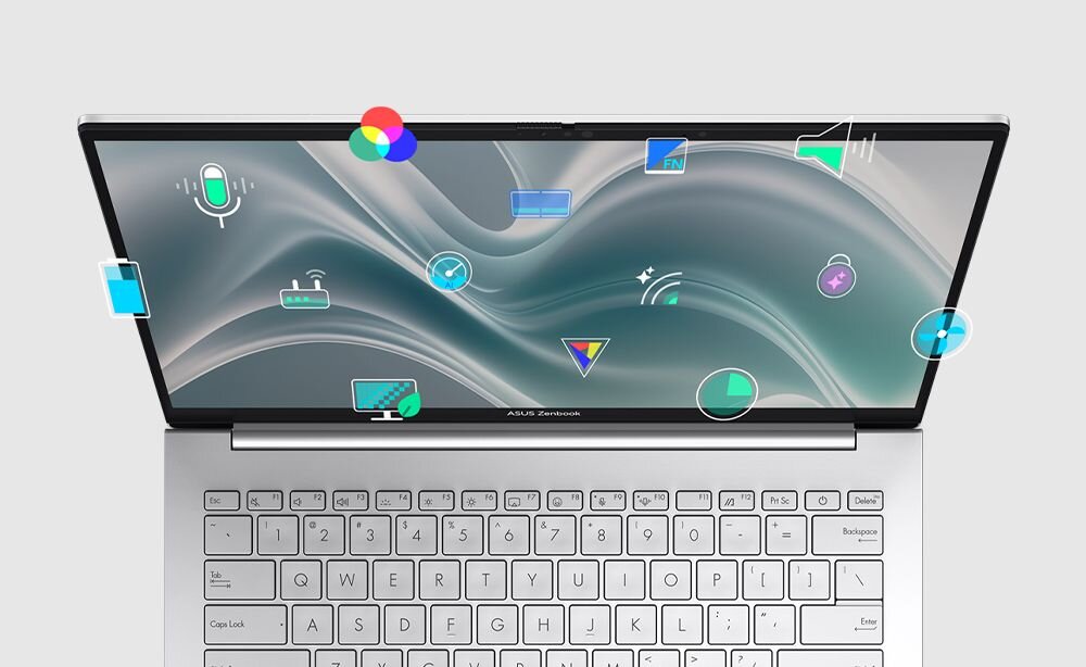 Laptop z otwartym ekranem, na którym widoczne są różne kolorowe ikony symbolizujące funkcje i aplikacje. Na dolnej ramce ekranu znajduje się napis \'ASUS Zenbook\'.
