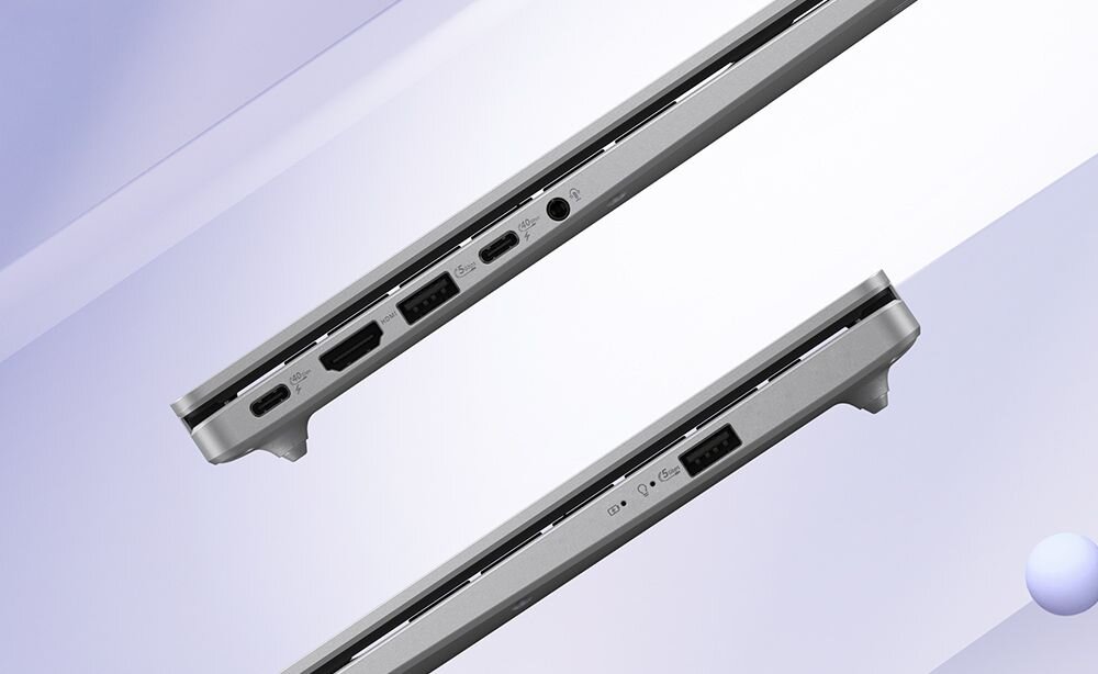 Obraz przedstawia dwa profile boczne laptopa z widocznymi portami, w tym USB, HDMI i gniazdo audio. Tło jest w odcieniach fioletu z delikatnymi gradientami.