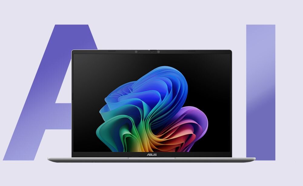 Laptop z logo ASUS na dolnej ramce ekranu, wyświetlający kolorową grafikę na ekranie. W tle widoczny jest duży napis \'AI\'.