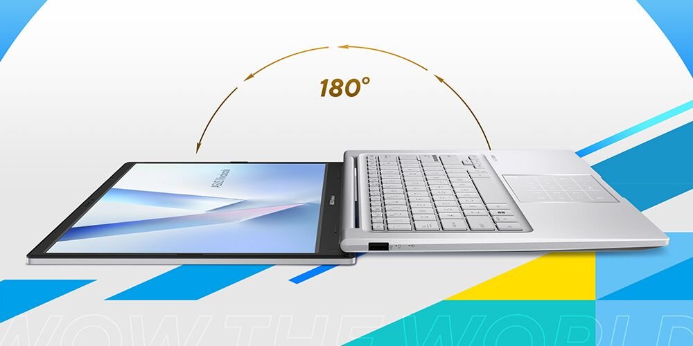 Laptop otwarty na płasko, z ekranem i klawiaturą w jednej płaszczyźnie, z napisem \'180°\' nad nim. W tle kolorowe elementy graficzne i częściowo widoczny tekst \'WOW THE WORLD\'.