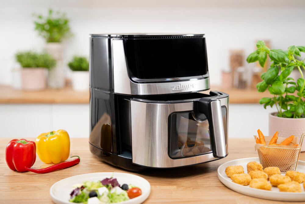 Air Fryer Frytkownica beztłuszczowa ZELMER ZAF8650 frytkownica srebrno czarna otwarty kosz okienko frytkownica stoi na blacie potrawy wokół urządzenia praktyczne rozwiązania izolowana obudowa ochrona przed oparzeniem antypoślizgowe nóżki stabilność zabezpieczenie przed przegrzaniem bezproblemowe użytkowanie kosz o pojemności 6,5 litra większe porcje ulubionych potraw  