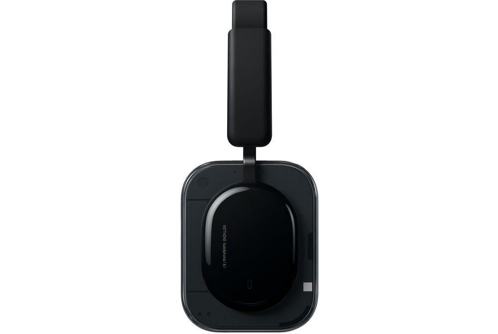 Czarne słuchawki nauszne z prostokątnym pałąkiem i owalnymi nausznikami. Na nauszniku widoczny jest napis \'NOTHING Headphone B186 ANC\'.