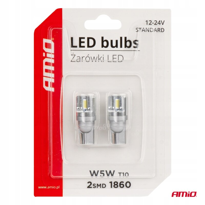 Opakowanie zawiera dwie żarówki LED W5W T10, oznaczone jako 2SMD 1860, przeznaczone do użytku w zakresie napięcia 12-24V. Na opakowaniu widoczne jest logo \'amio\'.