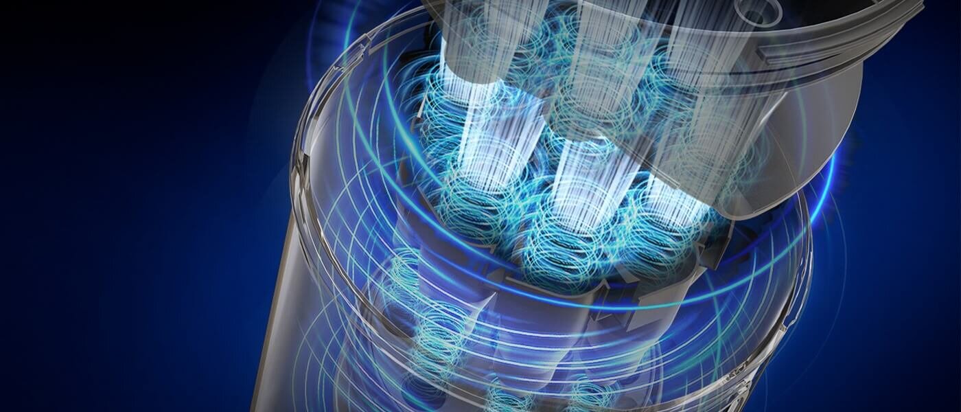 Obraz przedstawia wnętrze urządzenia z widocznymi niebieskimi wirującymi strumieniami powietrza. Tło jest ciemnoniebieskie.