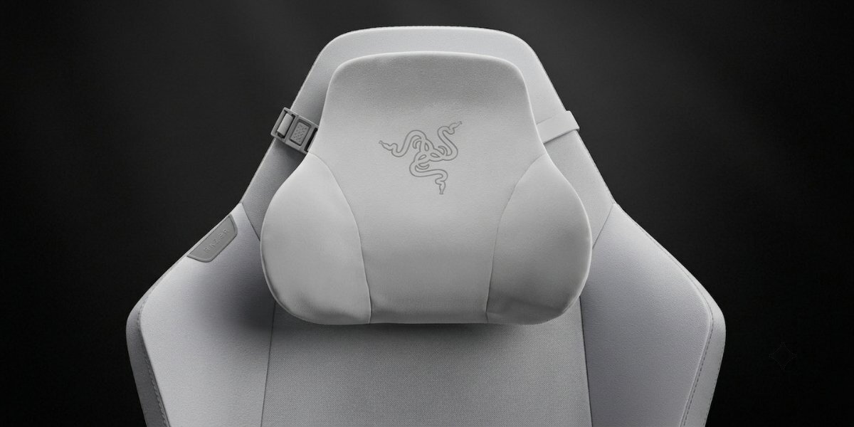 Przybliżenie na zagłówek fotela gamingowego Razer Iskur V2 Newgen, tło jest ciemne.