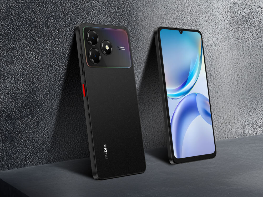 Smartfon ZTE Blade A36 4/64GB 6.75 90Hz Czarny Dwa telefony ZTE/nubia opierają się o ciemną, chropowatą ścianę i podłogę. Jeden jest czarny (widok od tyłu z potrójnym aparatem), drugi stoi obok, widok od przodu z włączonym, kolorowym ekranem.