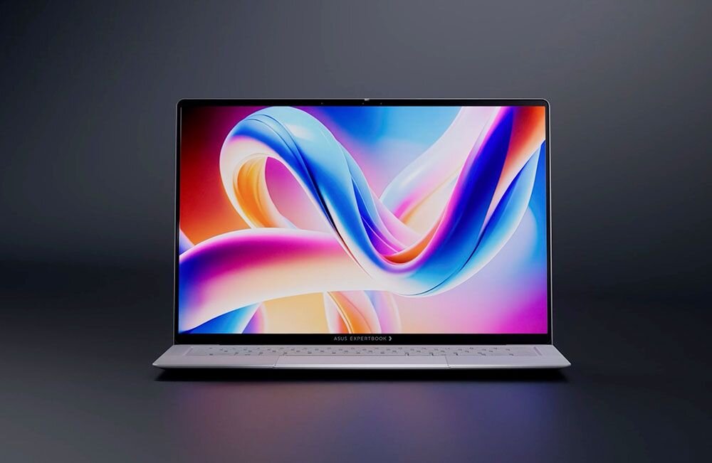Laptop z wyświetlaczem OLED prezentuje kolorową grafikę na ekranie. Na dolnej ramce widoczny jest napis \'ASUS EXPERTBOOK\'.