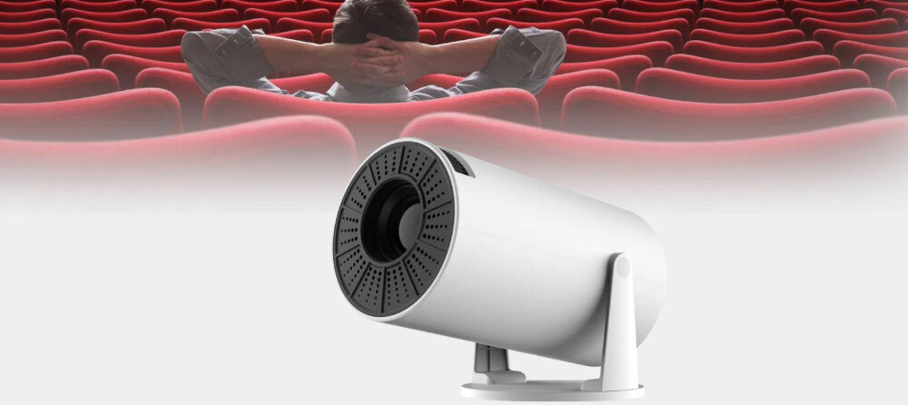Projektor KIANO Relax kino domowe jakość obrazu przestrzenny dźwięk mobilny projektor, projektor pod skosem na tle siedzeń kinowych