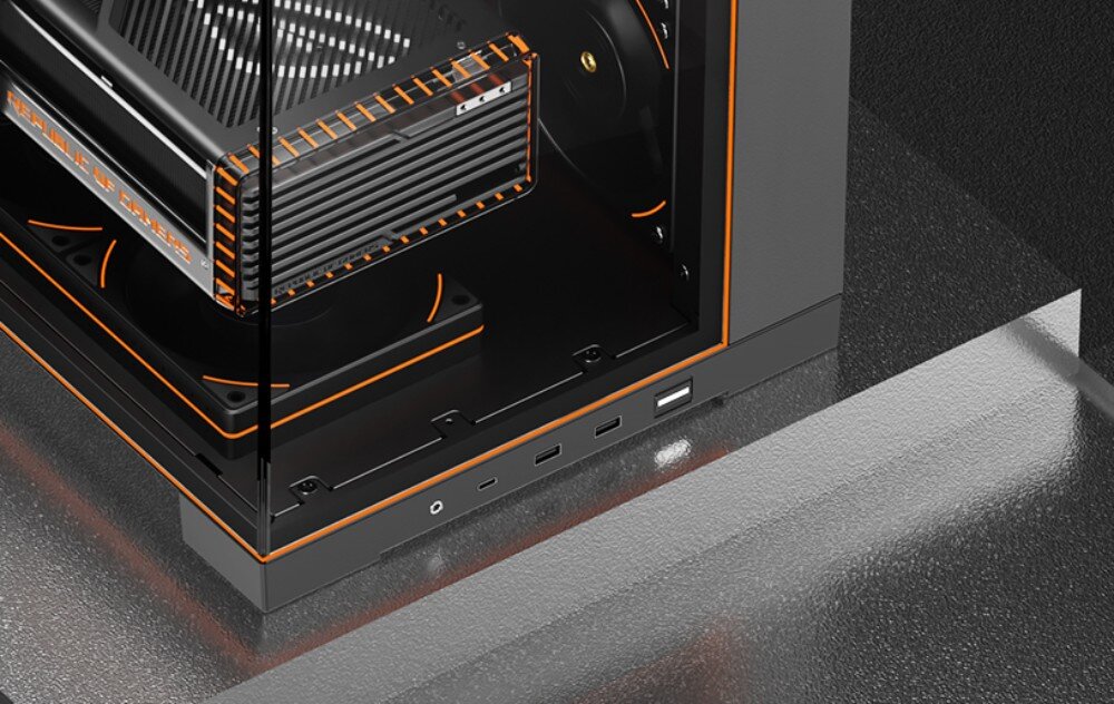 Obudowa THERMALRIGHT A70 Vision ARGB Fan zbliżenie na dolny róg obudowy komputerowej przez szklane panele, widać fragment karty graficznej, podświetlane na pomarańczowo wentylatory oraz zewnętrzny panel z portami USB i gniazdem audio
