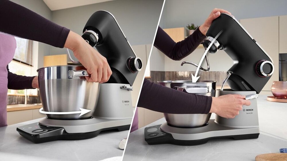 Na obrazie widoczny jest robot kuchenny z metalową misą, który jest obsługiwany przez osobę. Logo \'BOSCH\' znajduje się na urządzeniu.
