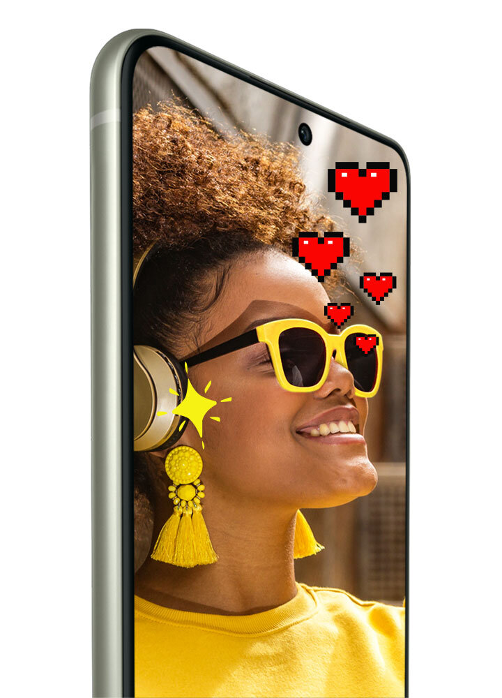 Na ekranie smartfona widać osobę w żółtych okularach i słuchawkach, z pikselowymi sercami i gwiazdką wokół głowy. Obudowa telefonu jest w kolorze lawendowym.