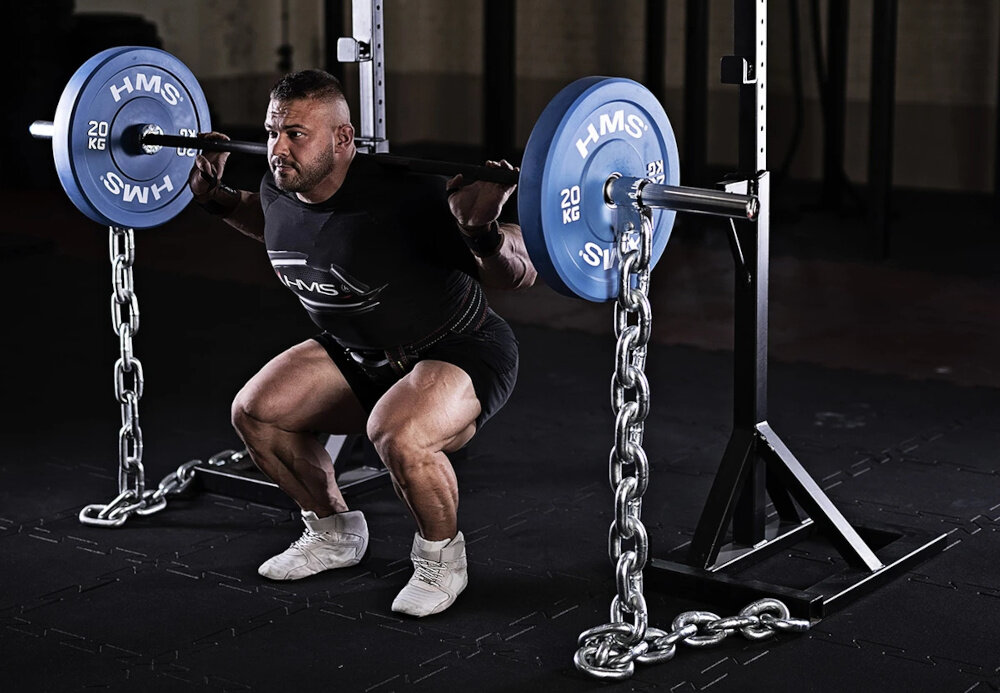 Obciążenie HMS CBR20 (20 kg) siłownia osoba podnosi sztangę z obciążeniami o wadze 20 kg do ćwiczeń ze sztangą i gryfami olimpijskimi średnica wewnętrzna 51 mm szybkie dopasowanie do standardowych gryfów sprawnie zmienisz ciężar płynność ćwiczeń