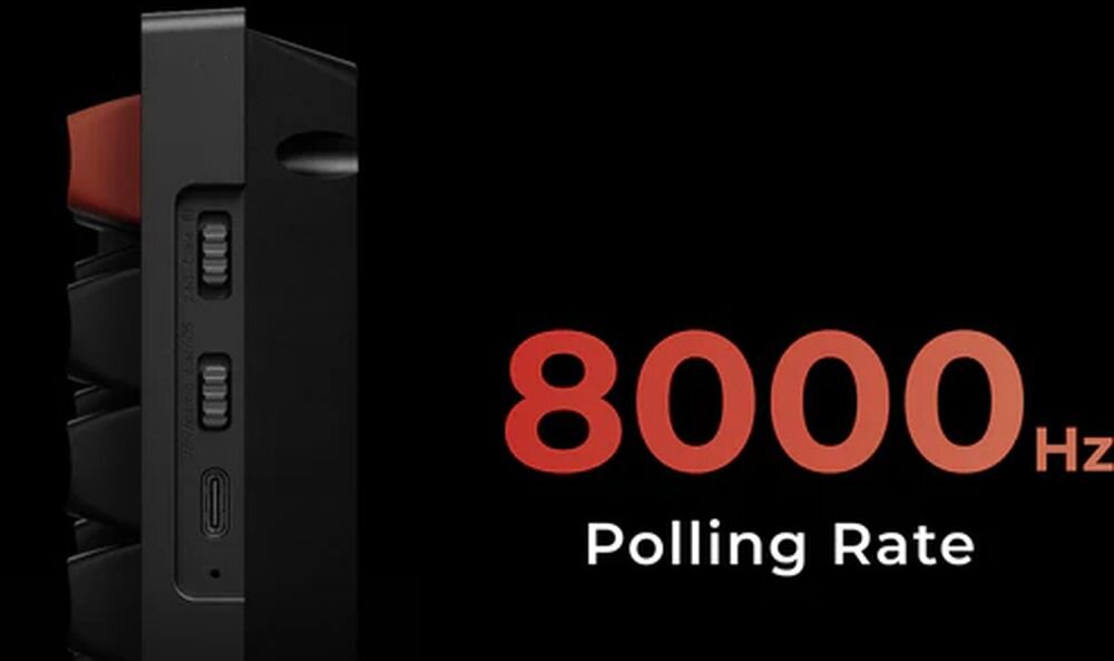 Obraz przedstawia fragment klawiatury z widocznymi przełącznikami i portem USB-C. Obok znajduje się tekst: \'8000 Hz Polling Rate\'.