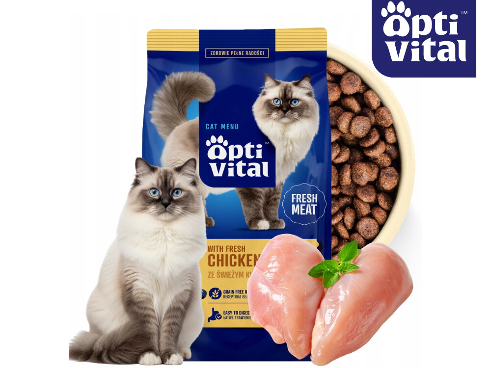 Na obrazie znajduje się opakowanie karmy dla kotów marki OptiVital z wizerunkiem kota, miska z karmą oraz kawałki surowego kurczaka. Widoczny jest tekst: \'OptiVital\', \'With Fresh Chicken\', \'Ze Świeżym Kurczakiem\', \'Fresh Meat\'.