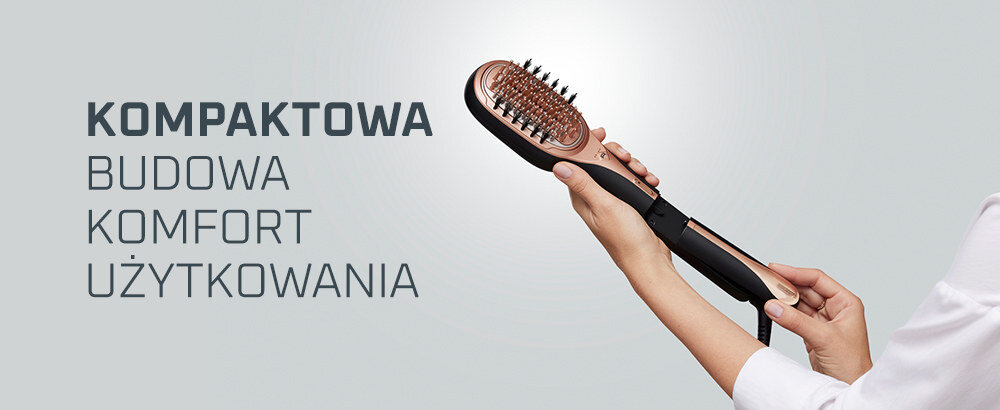 Osoba trzyma szczotkę prostującą z widocznymi ząbkami, obok napis: \'KOMPAKTOWA BUDOWA KOMFORT UŻYTKOWANIA\'.