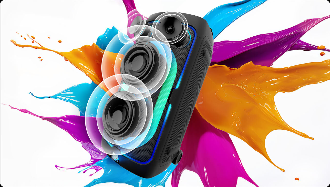 Sound Tower against paint color splash background plays powerful sound, as shown by soundwaves coming from the speaker cones.