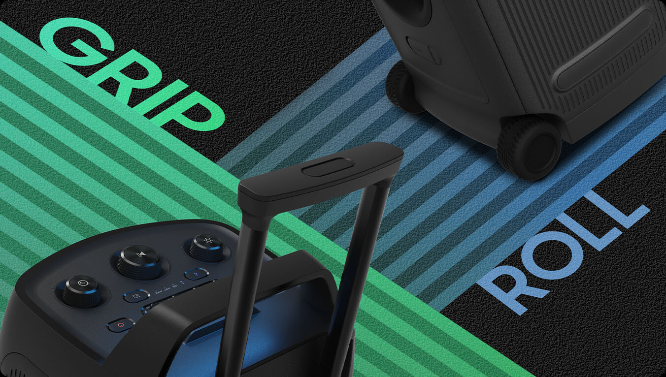 Close-up of the Sound Tower ST50F's handle with the word GRIP, and built-in wheels with the word ROLL.