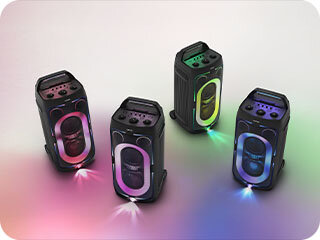 Four Samsung Sound Tower speakers emit different colored LED party lights.