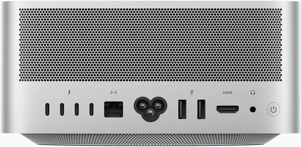 Tył komputera z widocznymi portami: dwa porty Thunderbolt, port Ethernet, gniazdo zasilania, dwa porty USB, port HDMI, port audio oraz przycisk zasilania. Obudowa jest srebrna z perforacją u góry.