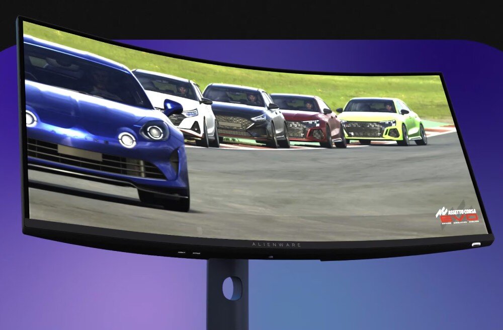 Monitor DELL Alienware AW3425DW Monitor na jednolitym fioletowym tle wyświetlający scenę z gry z wieloma pojazdami na zakręcie