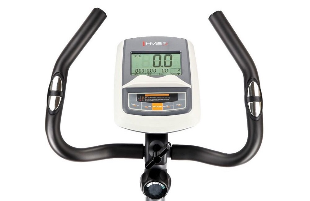 Konsola roweru magnetycznego z wyświetlaczem pokazującym \'SPEED 0.0\'. Widoczne logo \'HMS\' na górze panelu.