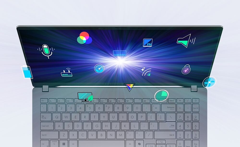 Laptop z otwartym ekranem, na którym widoczne są różnorodne ikony symbolizujące funkcje multimedialne i komunikacyjne. Klawiatura jest widoczna poniżej, a ekran emituje jasne światło z centrum.
