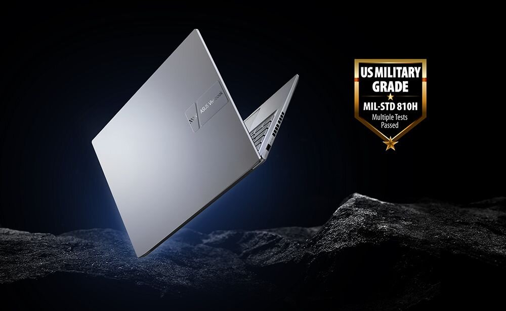 Laptop ASUS VivoBook 14 z certyfikatem MIL‑STD‑810H unosi się nad tłem, podkreślając wytrzymałość w pracy mobilnej - MIL-STD-810H 