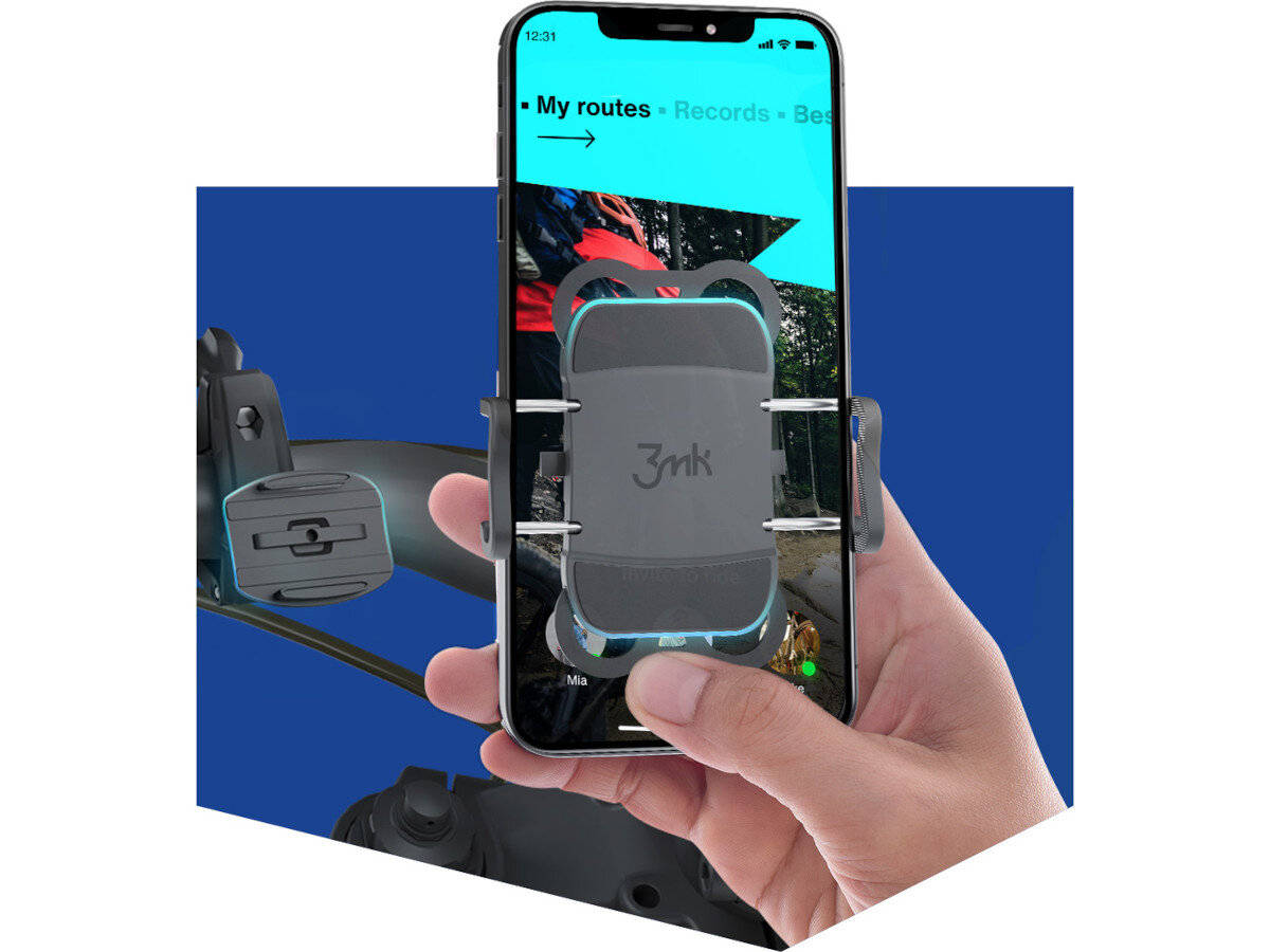 Osoba trzyma telefon zamocowany w uchwycie rowerowym 3MK Bike Holder Pro Czarny, z widocznym logo \'3mk\'. Na ekranie telefonu widoczny jest interfejs aplikacji z tekstem \'My routes • Records • Best\'.