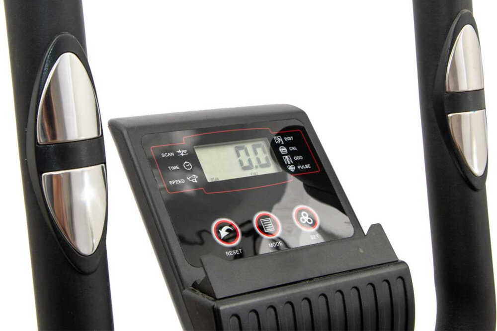 Na zdjęciu widoczny jest panel sterujący orbitreka z wyświetlaczem LCD pokazującym wartość 0.0 oraz przyciskami oznaczonymi jako RESET, MODE i SET. Po bokach panelu znajdują się uchwyty z metalicznymi elementami.