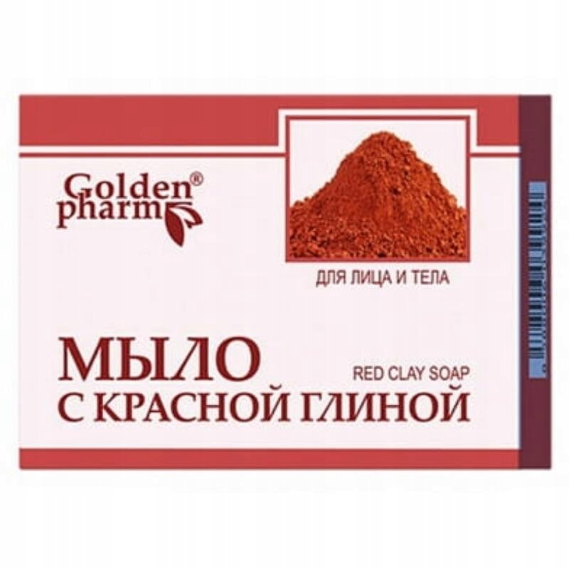 Opakowanie mydła z czerwonej glinki marki Golden Pharm. Widoczny jest obrazek czerwonej glinki oraz napisy: \'для лица и тела\', \'RED CLAY SOAP\', \'МЫЛО С КРАСНОЙ ГЛИНОЙ\'.