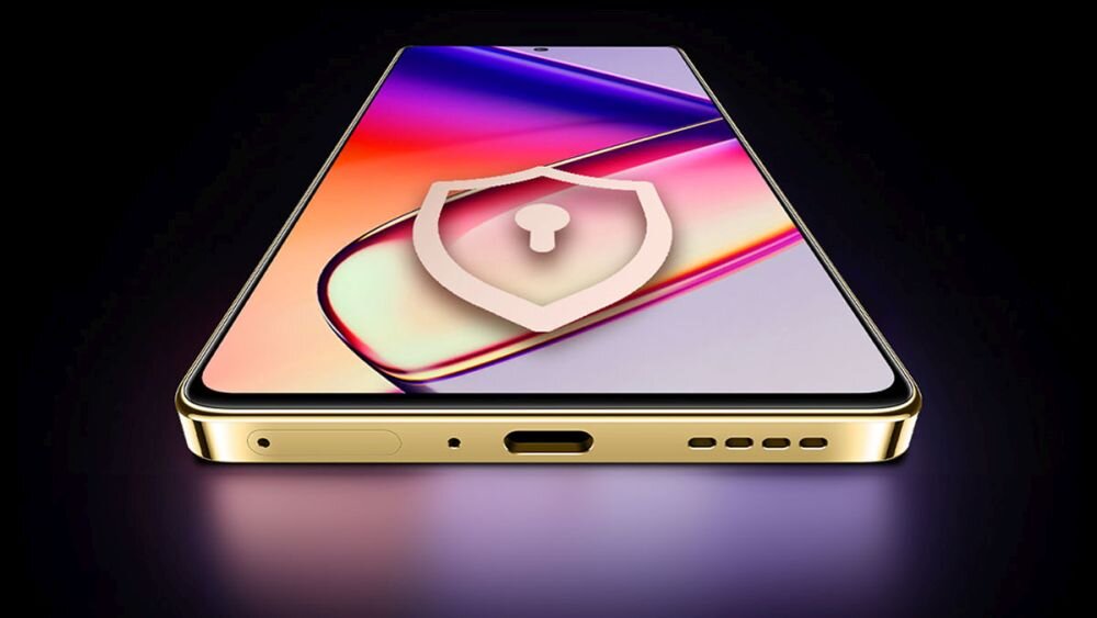 Smartfon w kolorze złotym z wyświetlaczem o gradientowych barwach, na którym widoczna jest ikona tarczy z kłódką. Na dolnej krawędzi znajdują się porty i otwory głośnika.