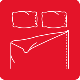 Ikona przedstawia białą grafikę dwóch poduszek i rozłożonego prześcieradła na czerwonym tle.