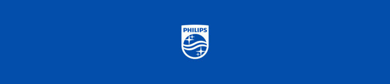 Obraz przedstawia logo PHILIPS na niebieskim tle. Logo składa się z białego napisu \'PHILIPS\' oraz symbolu tarczy z falami i gwiazdami.