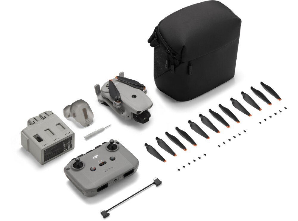 Dron DJI Lito X1 zestaw elementów na białym tle zawierający kontroler, złożonego drona, zapasowe śmigła, śrubokręt, kabel oraz osłonę gimbala