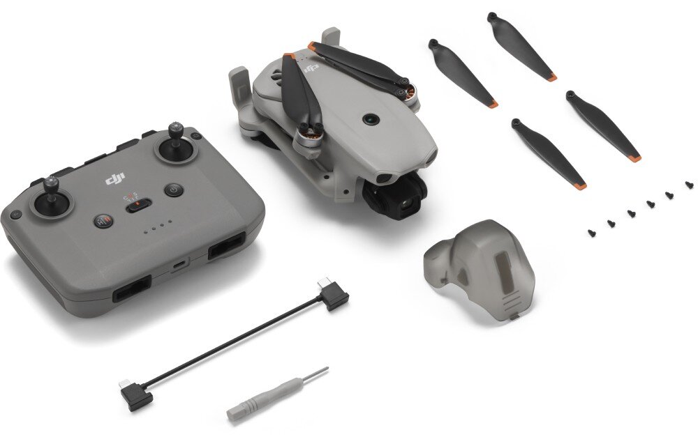 Dron DJI Lito X1 zestaw elementów na białym tle zawierający kontroler, złożonego drona, zapasowe śmigła, śrubokręt, kabel oraz osłonę gimbala