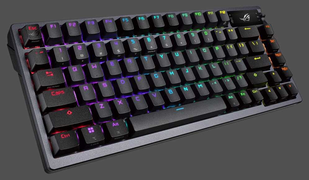 Klawiatura mechaniczna z podświetleniem RGB, posiada klawisze z oznaczeniami liter i funkcji. Widoczne jest logo producenta w prawym górnym rogu.