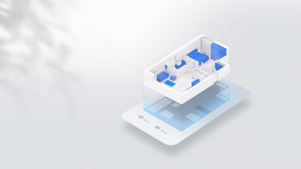 Grafika przedstawia trójwymiarowy model pomieszczenia z niebieskimi meblami na białym tle. Na dole widoczny jest tekst: \'Dock\', \'Clean\', \'Pause\'.