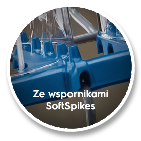 Obraz przedstawia niebieski element zmywarki z przezroczystymi wspornikami. Na dole widoczny jest tekst: \'Ze wspornikami SoftSpikes\'.