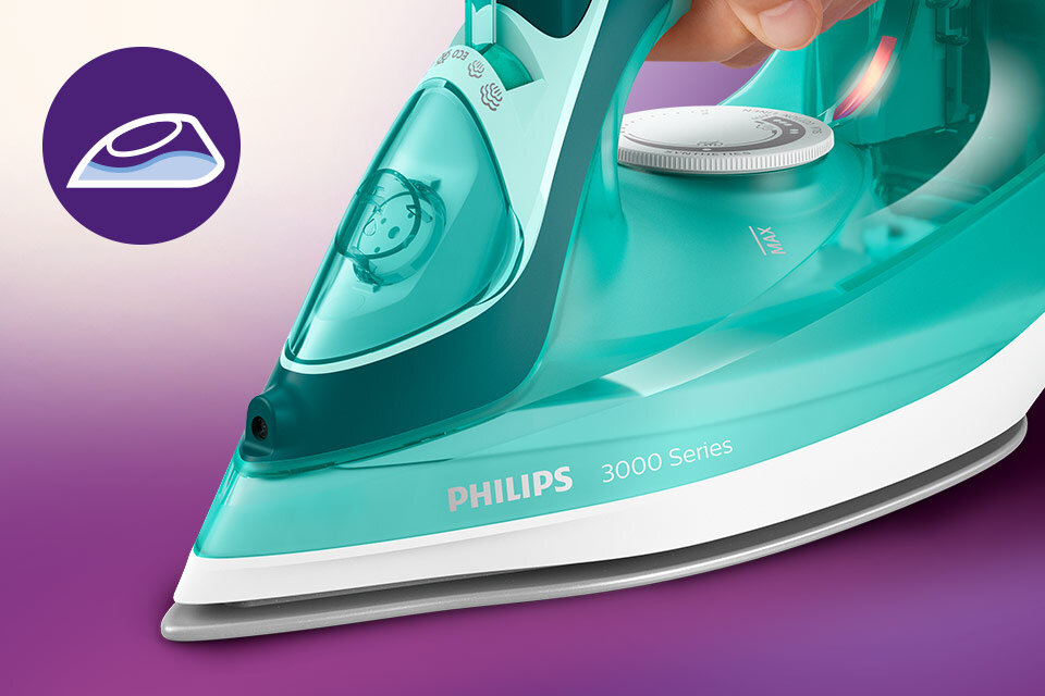Żelazko w kolorze turkusowym z widocznym logo PHILIPS 3000 Series. Obok znajduje się ikona przedstawiająca żelazko na fioletowym tle.