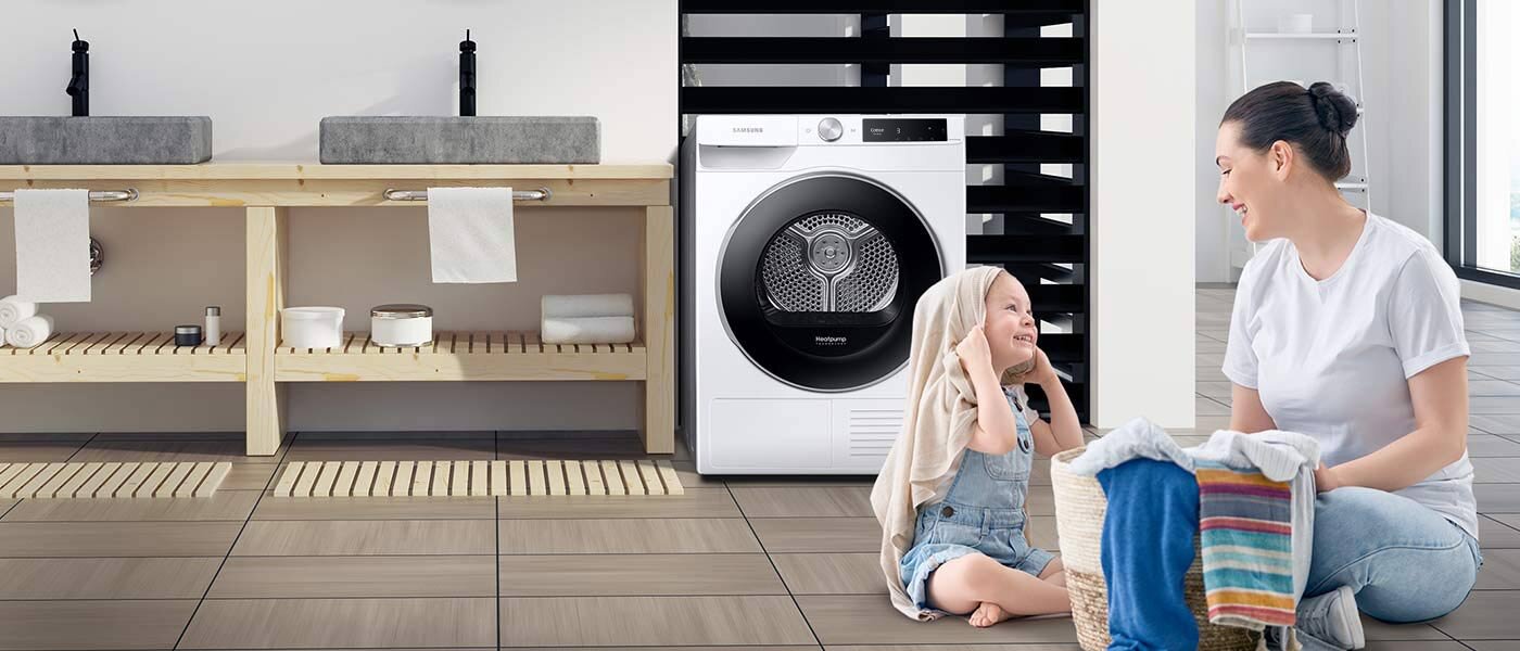 Minimalistyczna kuchnia, w której stoi suszarka Samsung