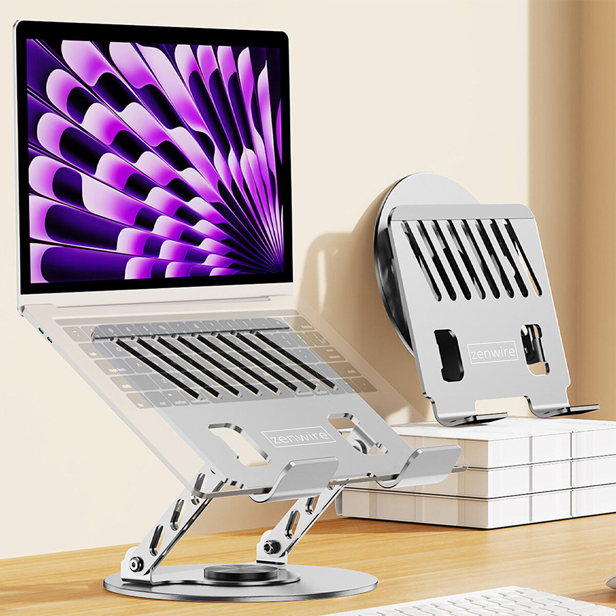 Na obrazie widoczna jest regulowana podstawka pod laptopa z logo \'zenwire\', na której umieszczony jest laptop z wyświetlaczem pokazującym abstrakcyjny wzór w odcieniach fioletu. Obok znajduje się złożona podstawka o podobnej konstrukcji.